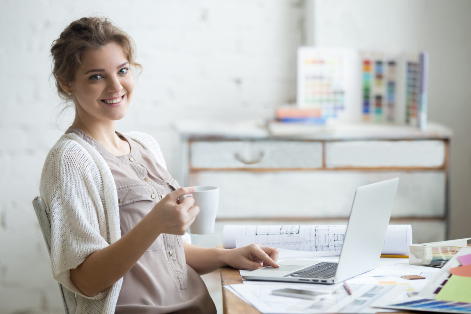 Portrait,Of,Beautiful,Happy,Smiling,Young,Designer,Woman,Sitting,At Portrait,Of,Beautiful,Happy,Smiling,Young,Designer,Woman,Sitting,At